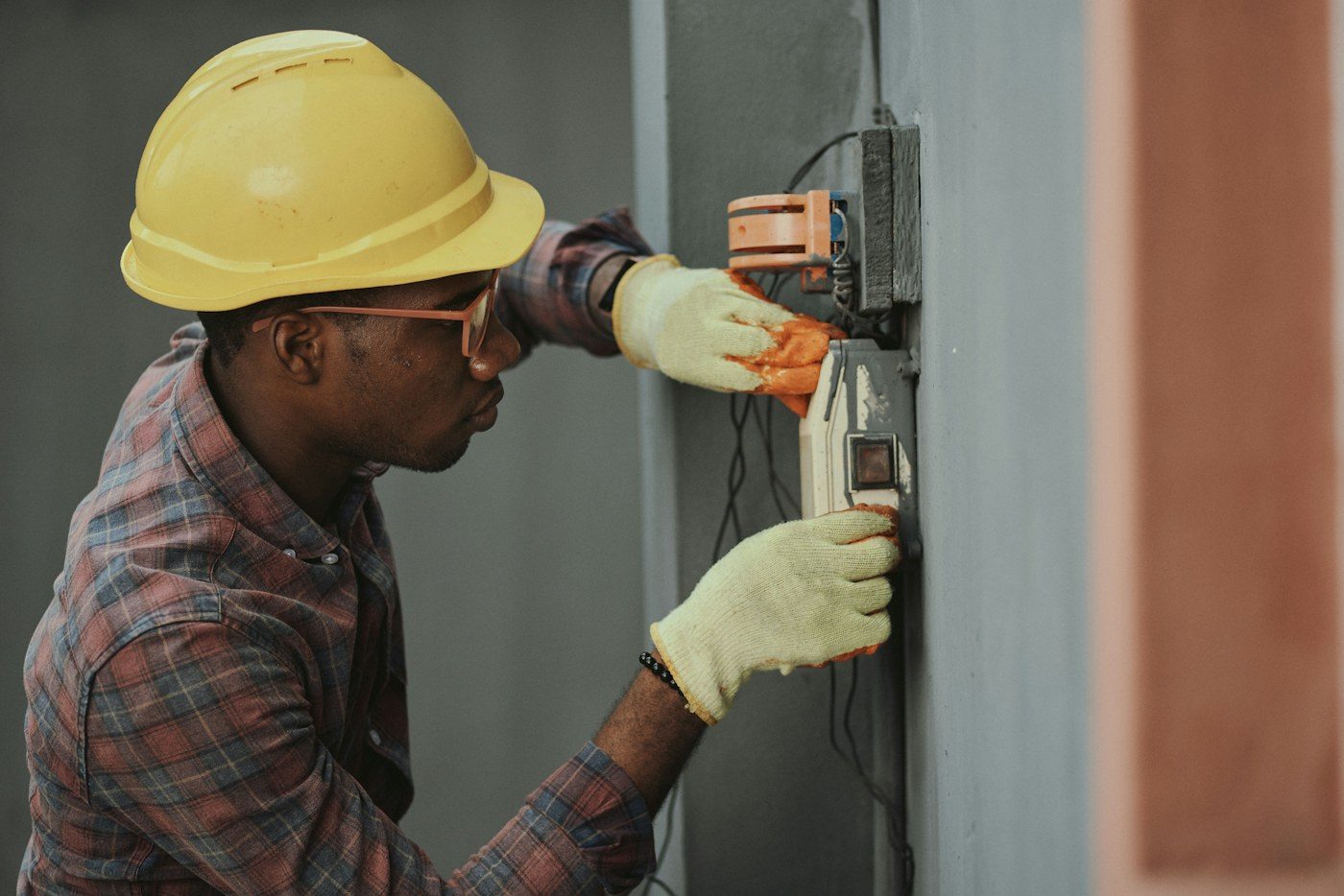 Irrigation technician working on outdoor control equipment